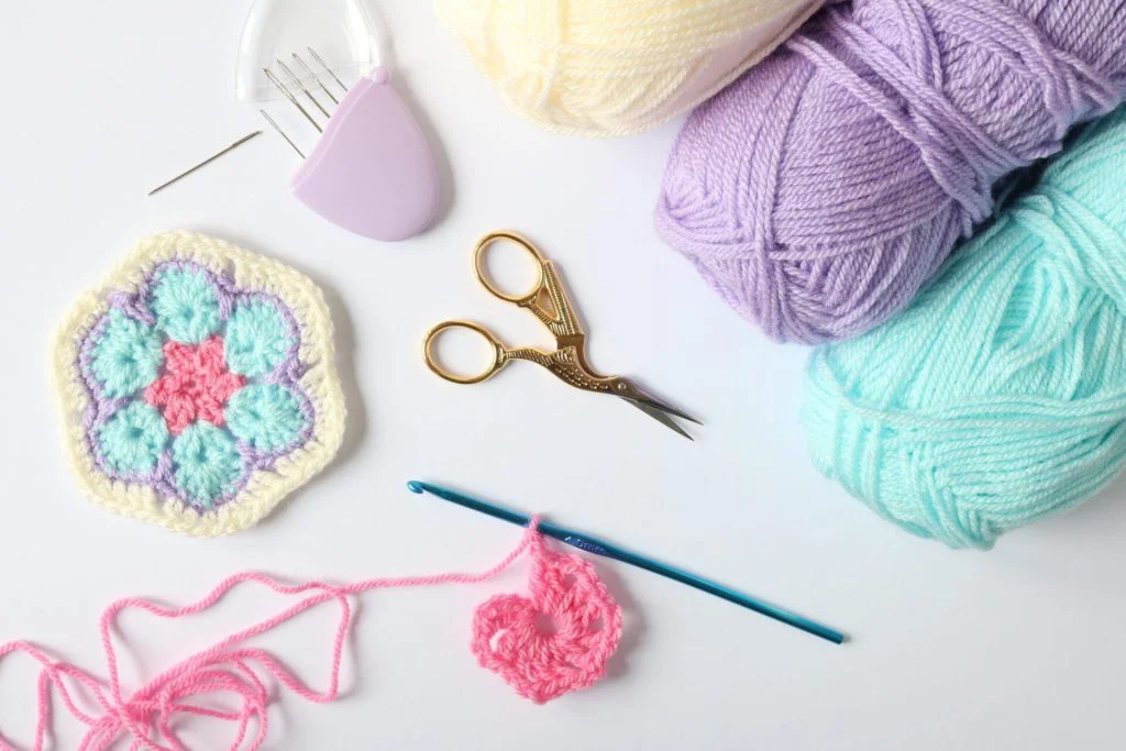 African Flower crochet with scissors, dk yarn and darning needles.